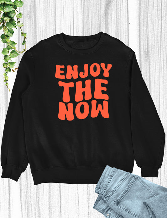 Embrace the present moment and spread joy with our 'Enjoy The Now' Funny Christian Sweatshirt, a delightful reminder to live life to the fullest in faith and laughter