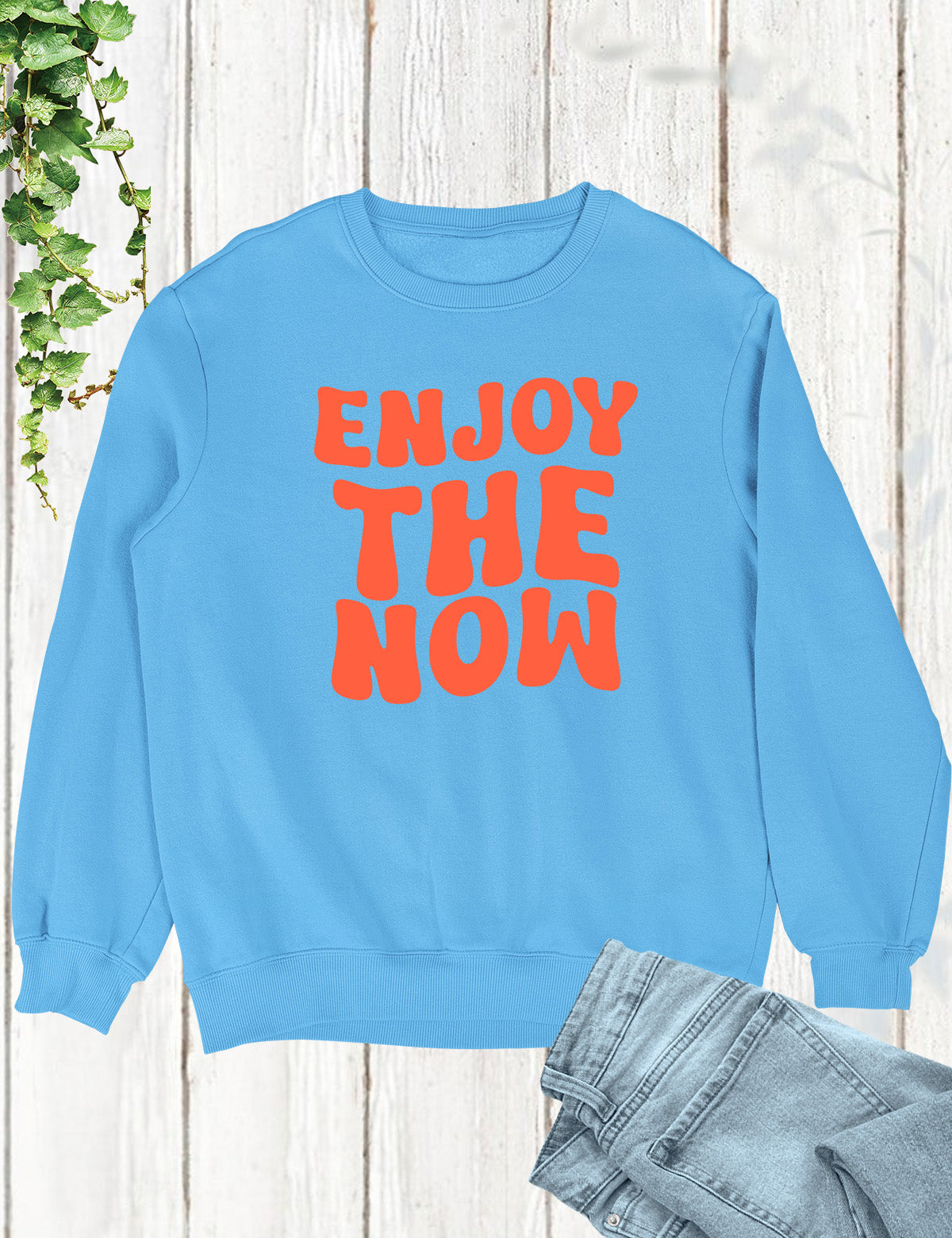 Embrace the present moment and spread joy with our 'Enjoy The Now' Funny Christian Sweatshirt, a delightful reminder to live life to the fullest in faith and laughter