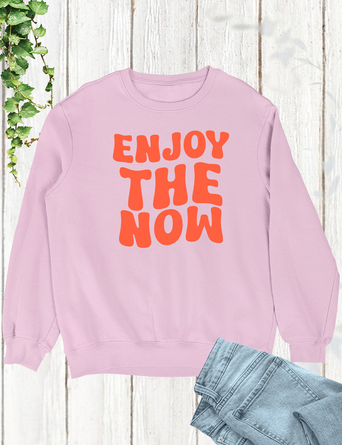 Embrace the present moment and spread joy with our 'Enjoy The Now' Funny Christian Sweatshirt, a delightful reminder to live life to the fullest in faith and laughter